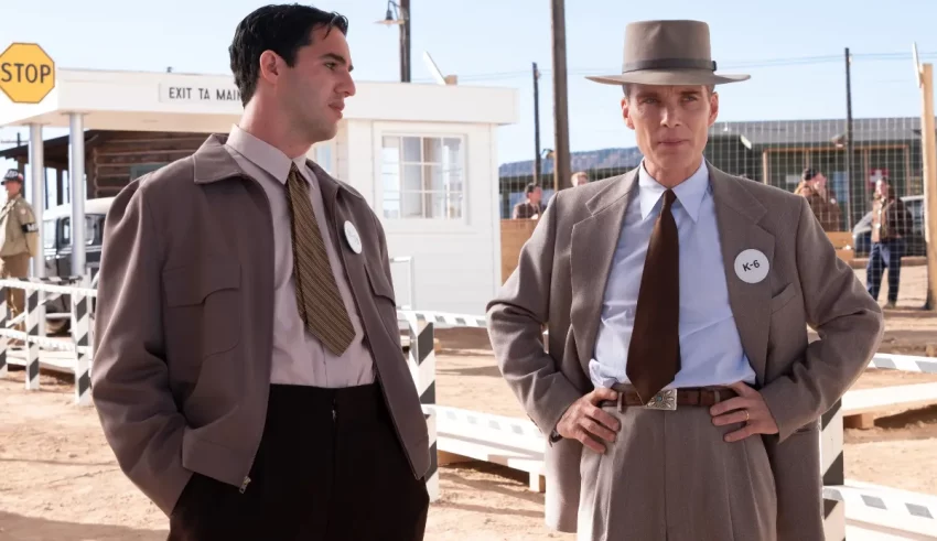 Two men in suits standing next to each other.