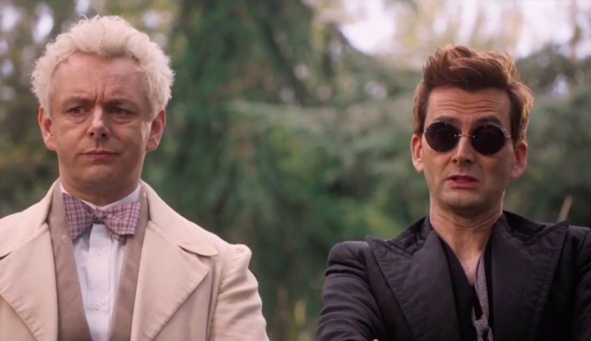 Two men in sunglasses standing next to each other.