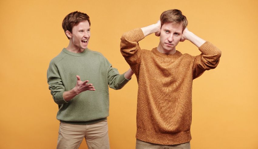 Two men are arguing with each other on a yellow background.