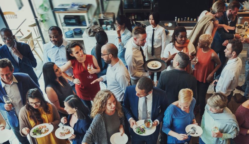 A group of people eating food in a restaurant.