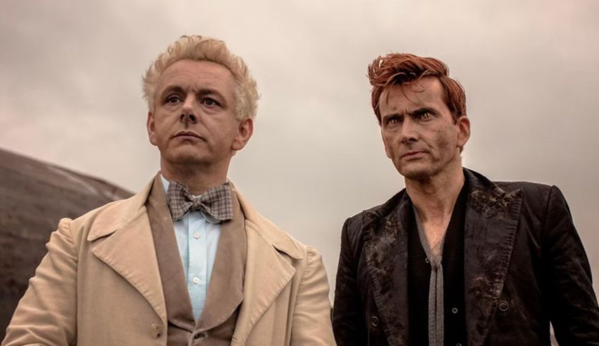 Two men standing next to each other in front of a cloudy sky.