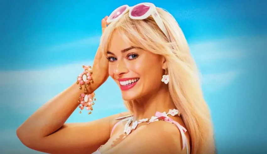 A blonde woman in a bikini posing for a photo.