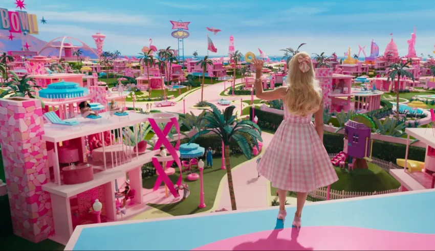 A girl is standing on top of a pink city.
