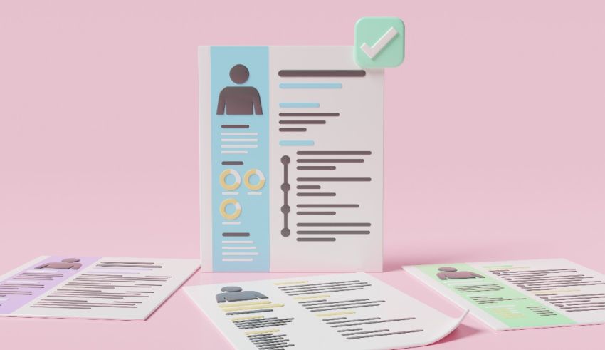 A set of paper resumes on a pink background.
