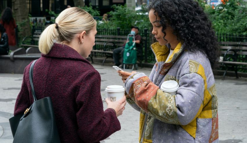 Two women talking on a cell phone.