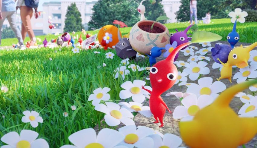 A group of small figurines in a grassy field.