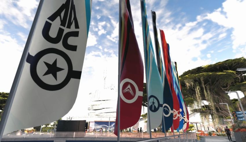 A group of flags in front of a building.