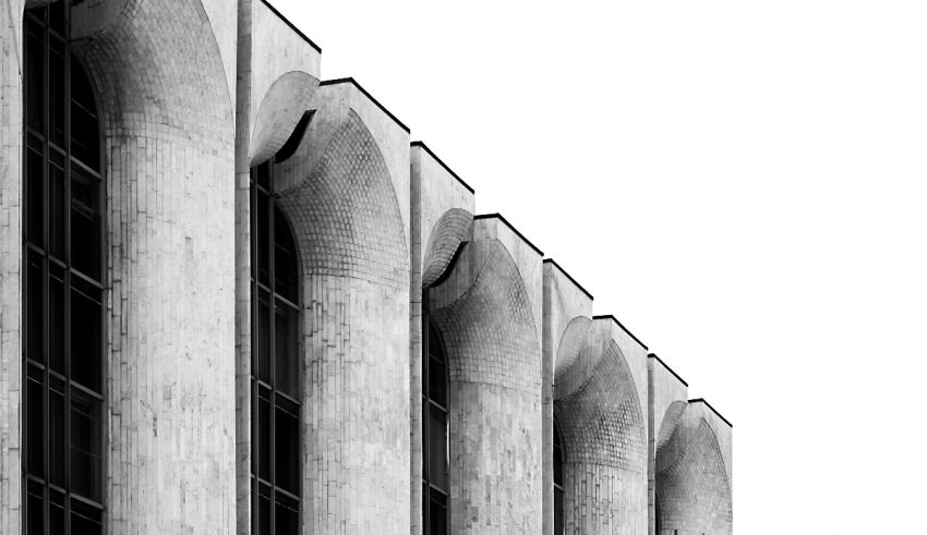 A black and white photo of a building with columns.