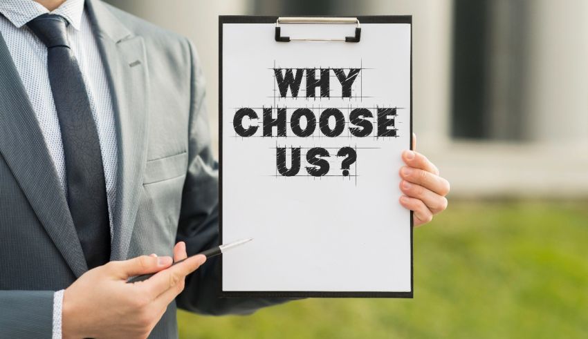 A businessman holding a clipboard with the words why choose us?.