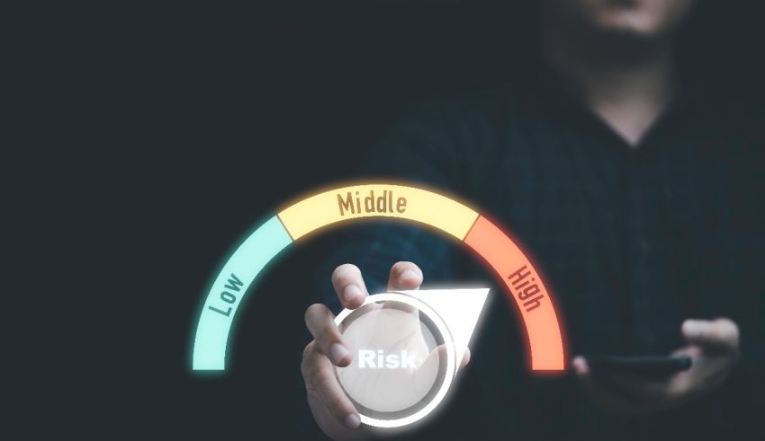 A man is holding a phone with the word risk on it.