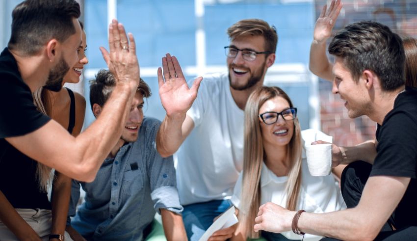 A group of people giving high fives to each other.