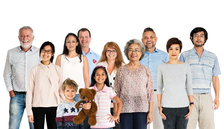 A group of people standing in front of a white background.