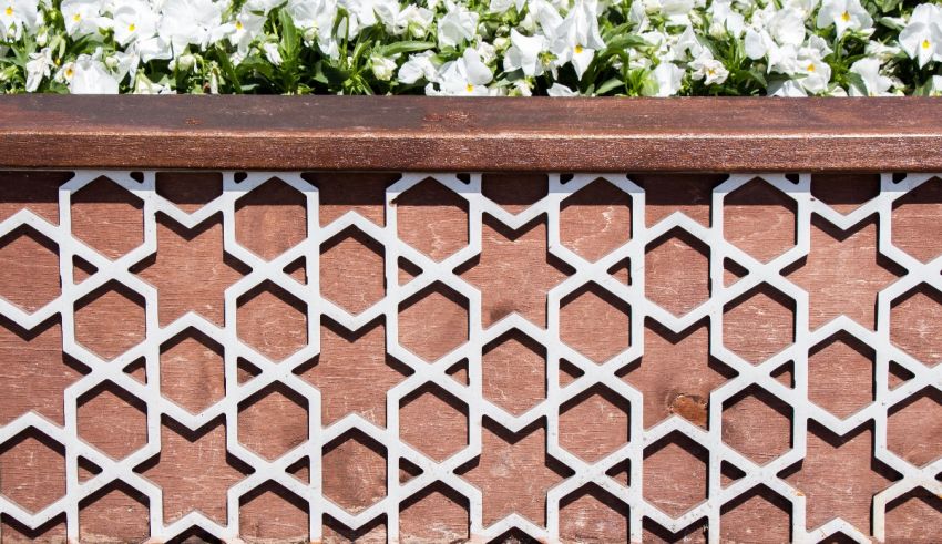 A wooden planter with white daffodils in it.