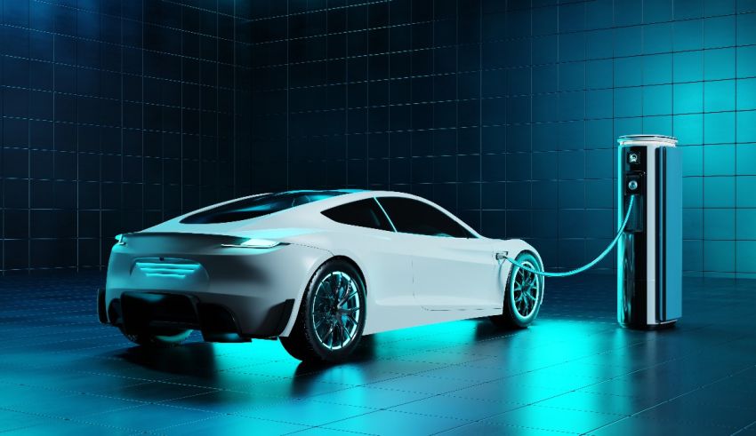 A white electric car charging at a charging station.