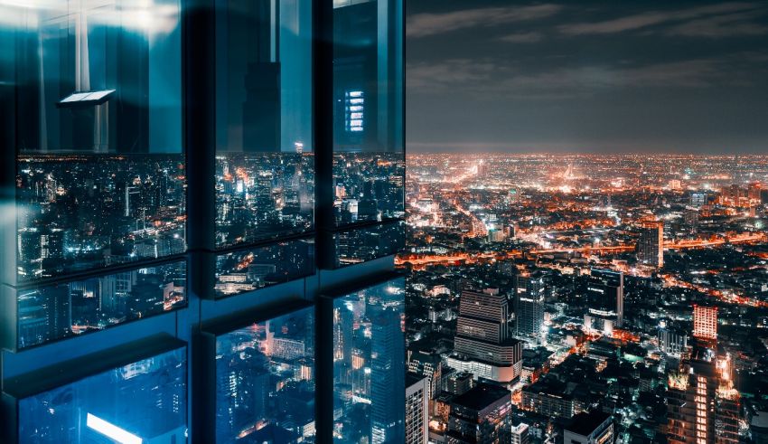 A view of a city from a tall building at night.