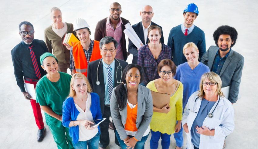 A group of people standing together in front of a building.