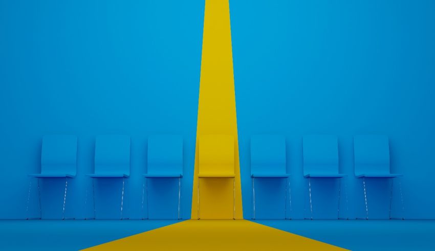 A blue room with chairs and a yellow line.