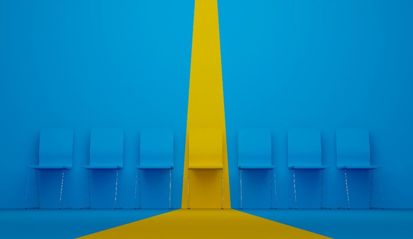 A blue room with chairs and a yellow line.