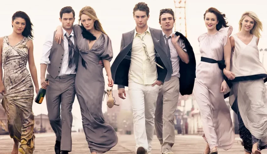 A group of people in formal attire walking down the street.