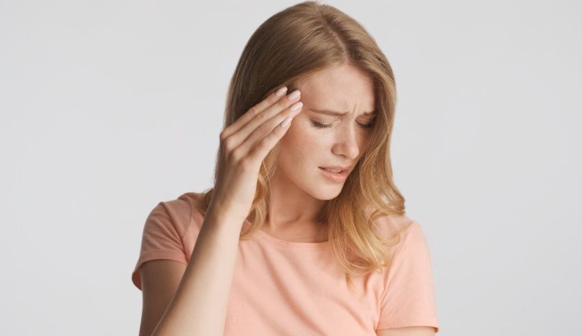 A woman with a headache on her head.