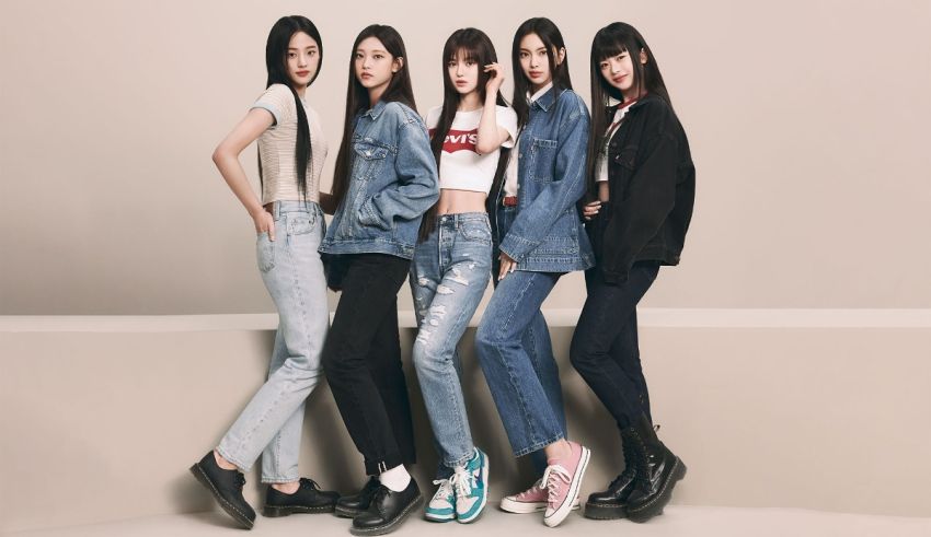 Five asian girls in denim jackets posing for a photo.