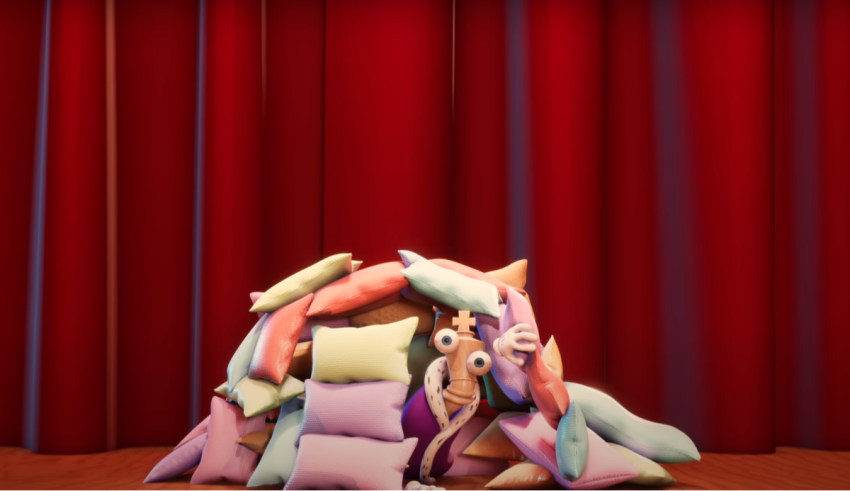 A pile of pillows in front of a red curtain.