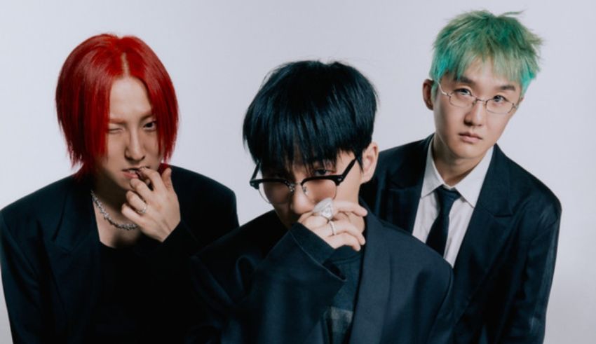Three asian men with green hair posing for a photo.