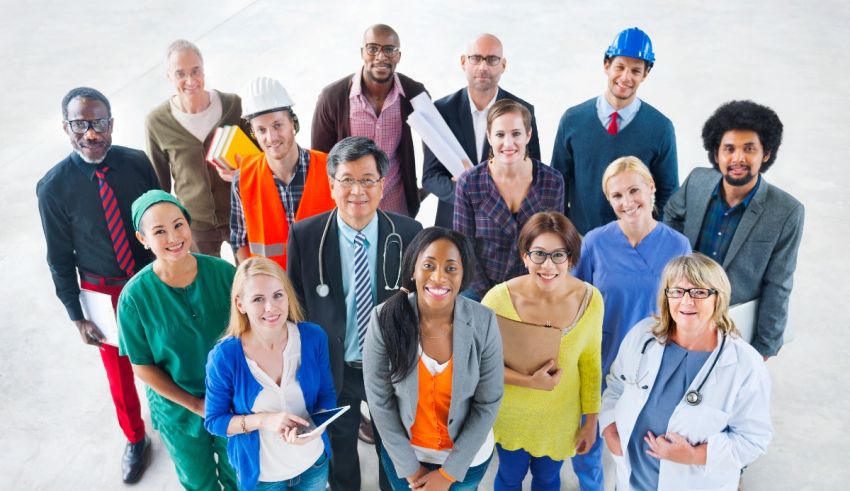 A group of people standing together in an office.