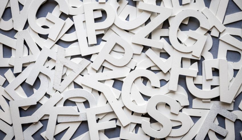 A large pile of white letters on a gray background.