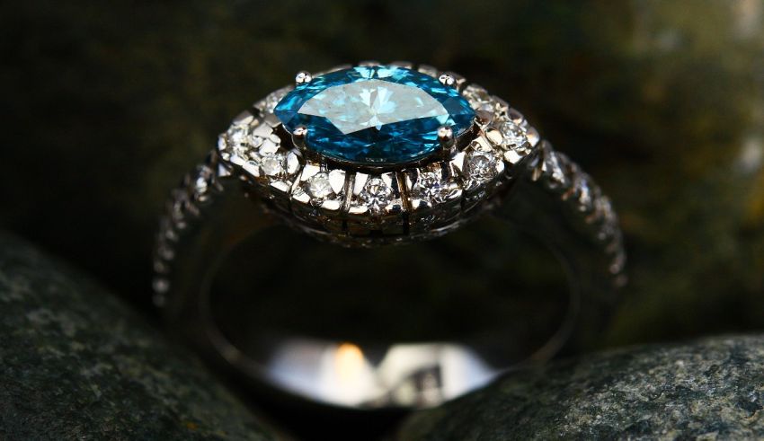 A ring with a blue topaz and diamonds.