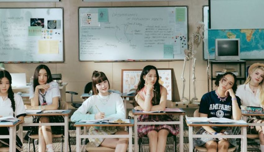 A group of girls sitting at desks in a classroom.