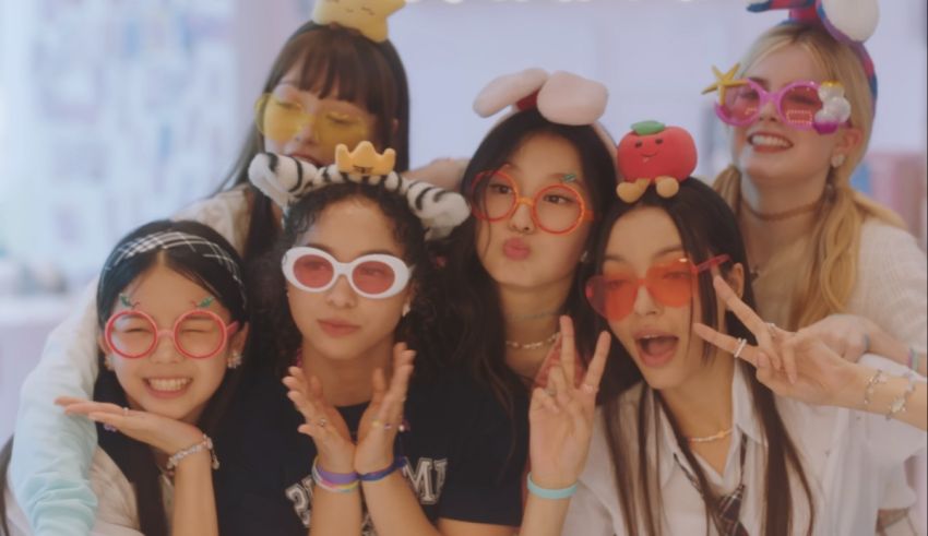 A group of girls posing for a photo with sunglasses.