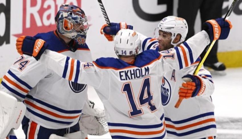 The edmonton oilers celebrate after scoring a goal.