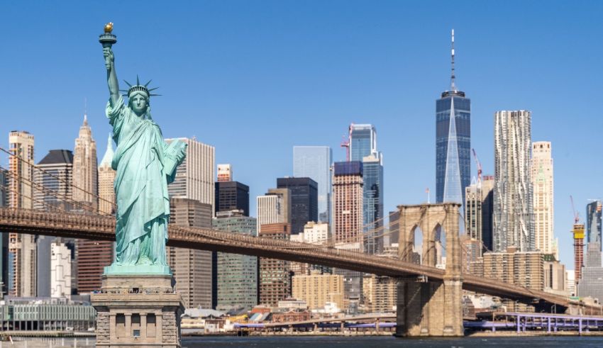 The statue of liberty and the brooklyn skyline in new york city.