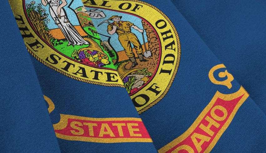 The state of idaho flag is shown on a blue background.