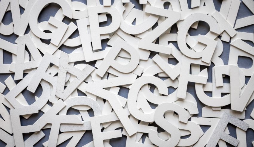 A large pile of white letters on a blue background.