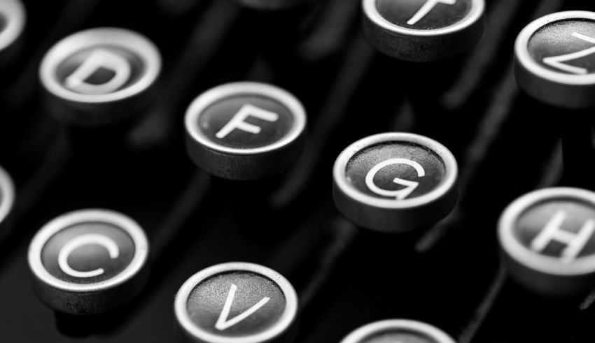 A black and white photo of typewriter keys.