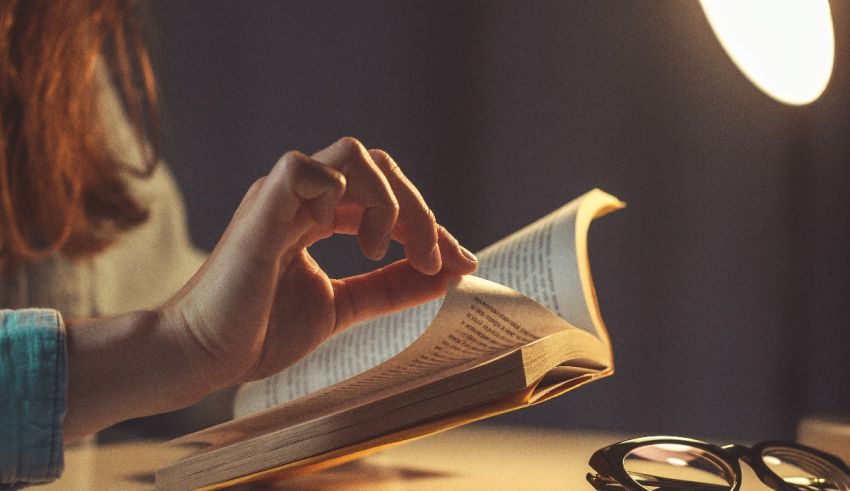 A woman is reading a book.