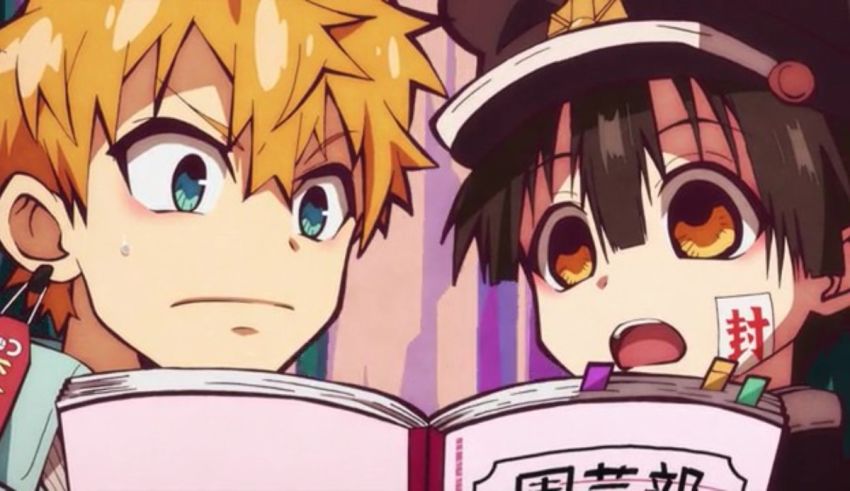 Two anime characters reading a book.