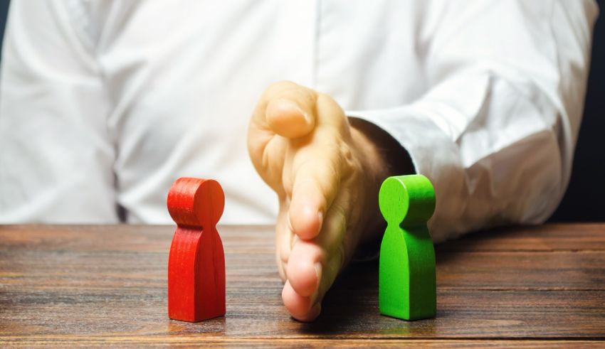 A businessman is reaching out to a wooden figure.