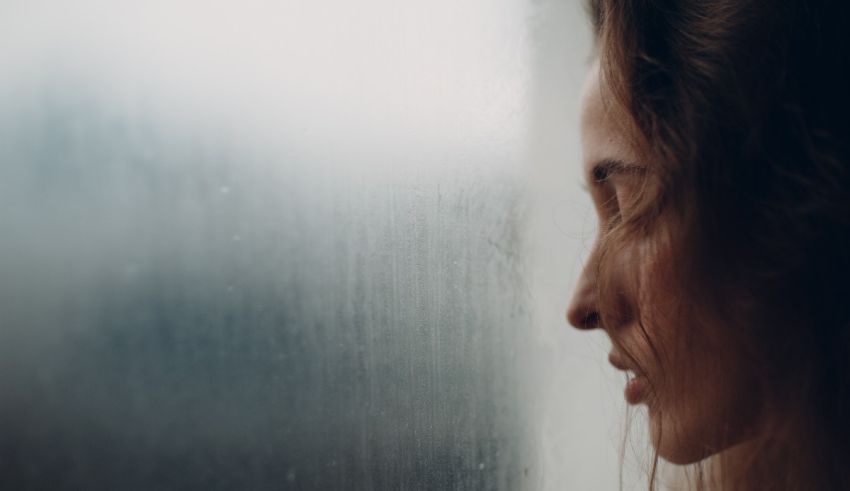 A woman looking out of a window.