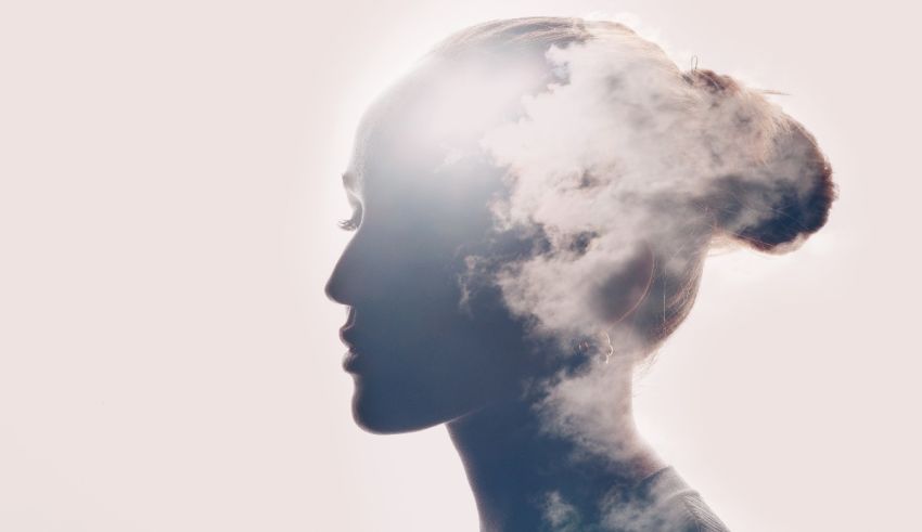 A silhouette of a woman with smoke coming out of her head.